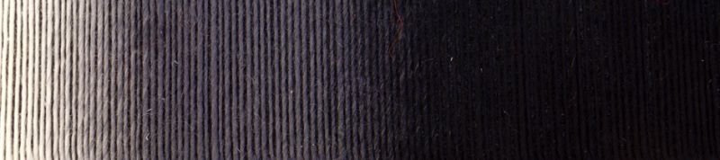 Up close image of white and black gradient yarn