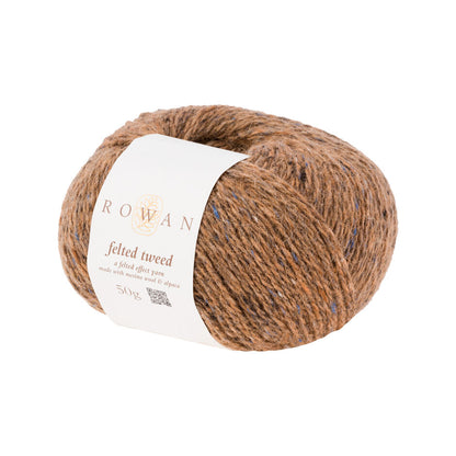 Ball of orange-peach tweed yarn with a Rowan label 