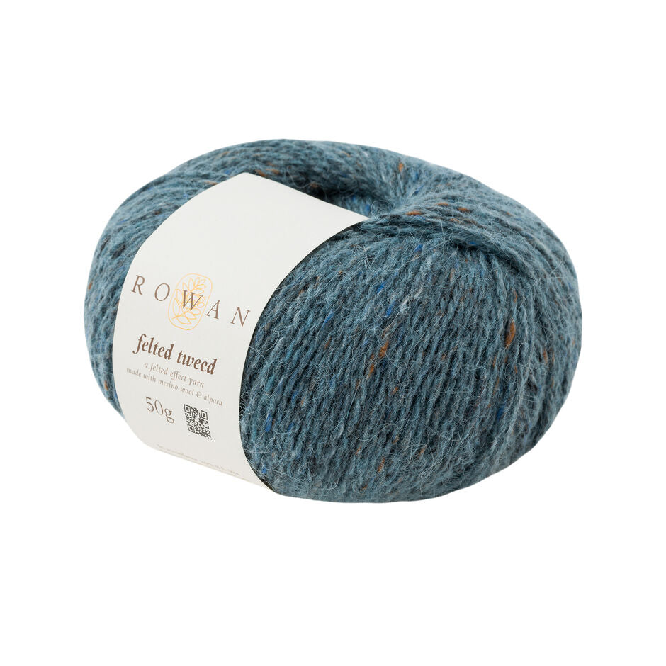 Ball of dark teal tweed yarn with a Rowan label 