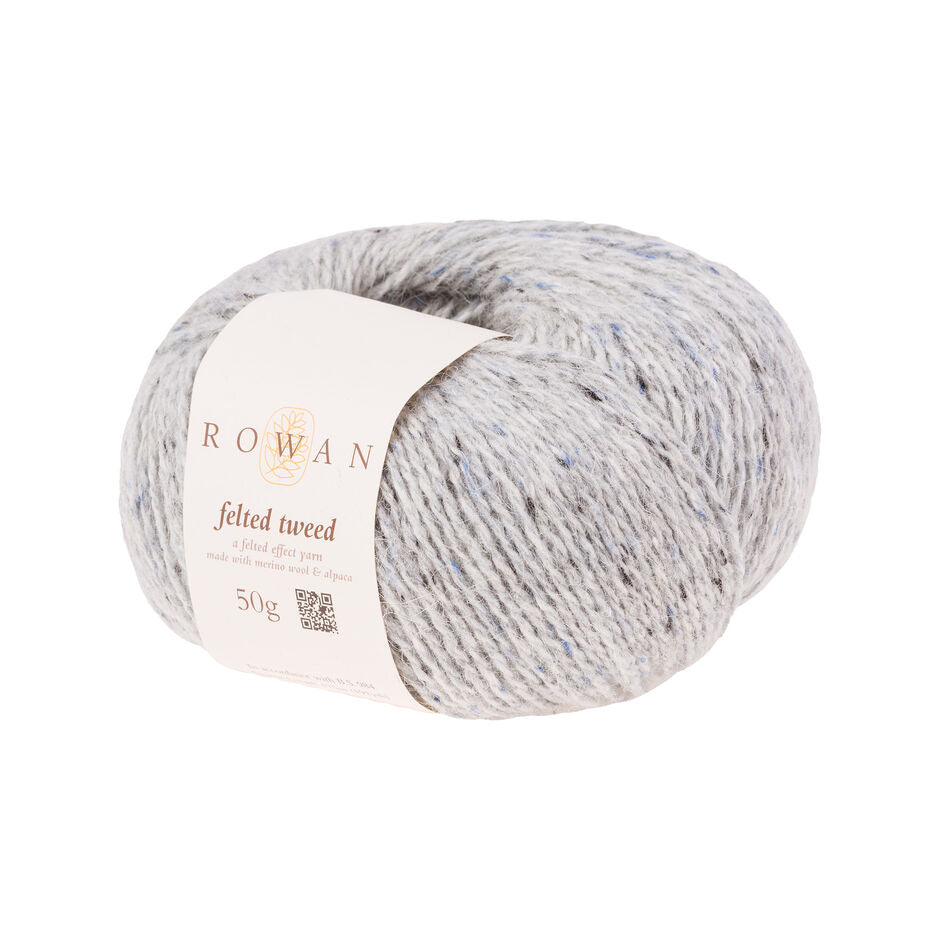 Ball of white tweed yarn with a Rowan label 