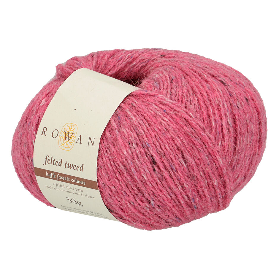 Ball of flamingo pink tweed yarn with a Rowan label 