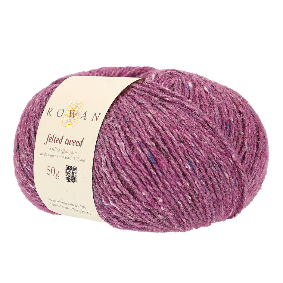 Ball of rose pink tweed yarn with a Rowan label 