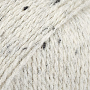 Close-up of white and black wool/alpaca/viscose yarn from Drops