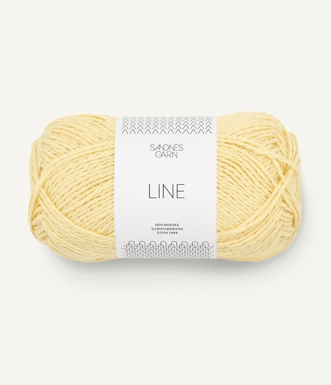 A ball of pale yellow coloured cotton/linen/viscose yarn labeled 'Line' by Sandnesgarn