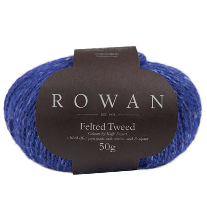 Ball of deep blue tweed yarn with a Rowan label 