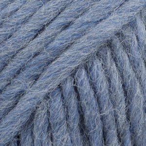 Close-up of a ball of blue-colored wool yarn from Drops