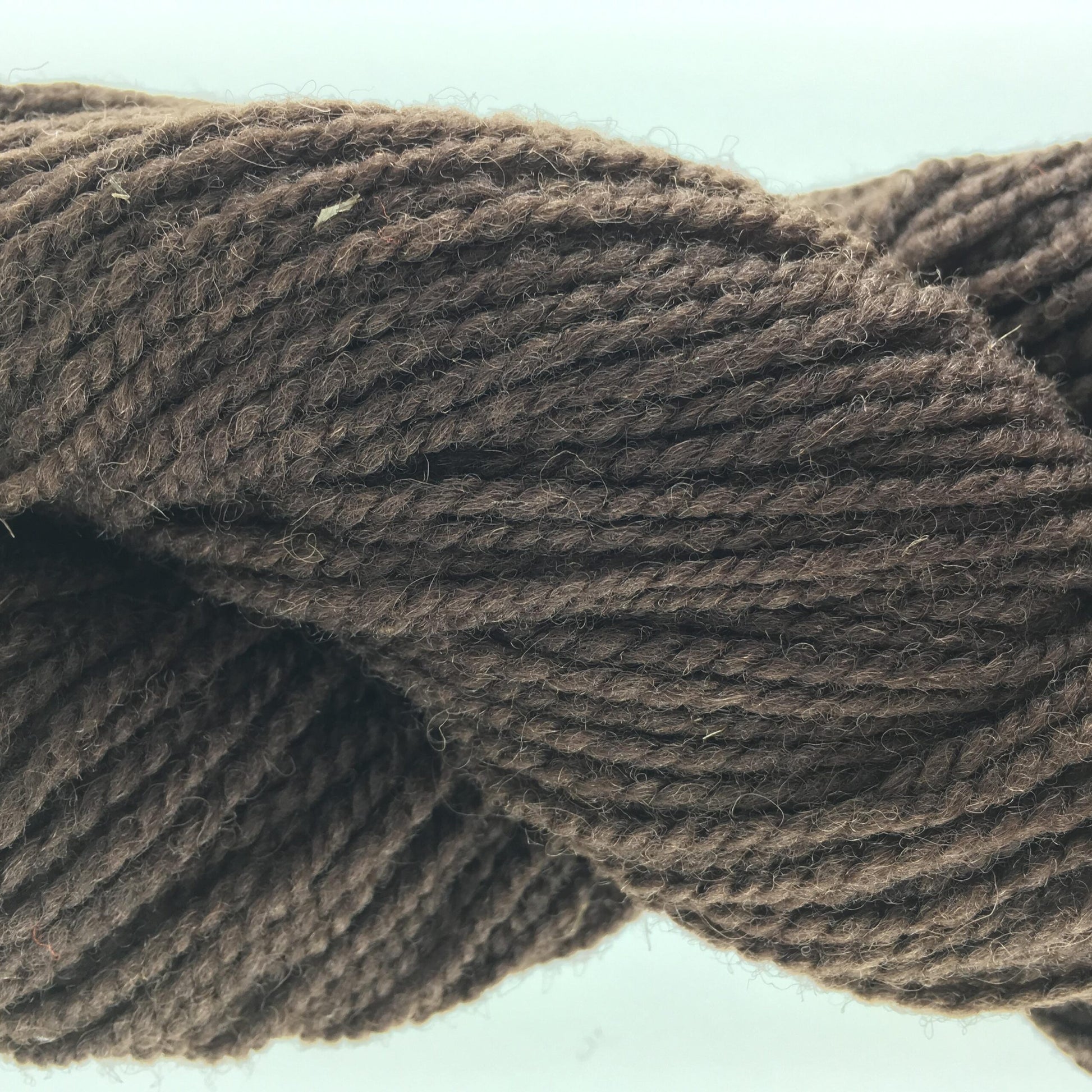 Close-up of a skein of medium brown coloured wool yarn