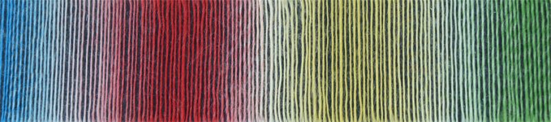 Up close image of red, blue, yellow, and green yarn