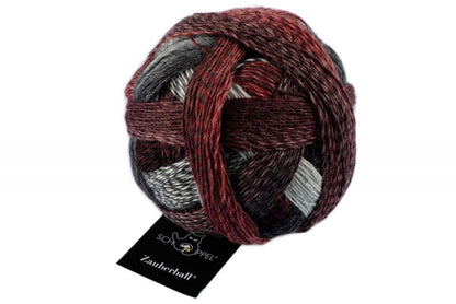 Ball of wool and nylon yarn in red, grey, and black colours