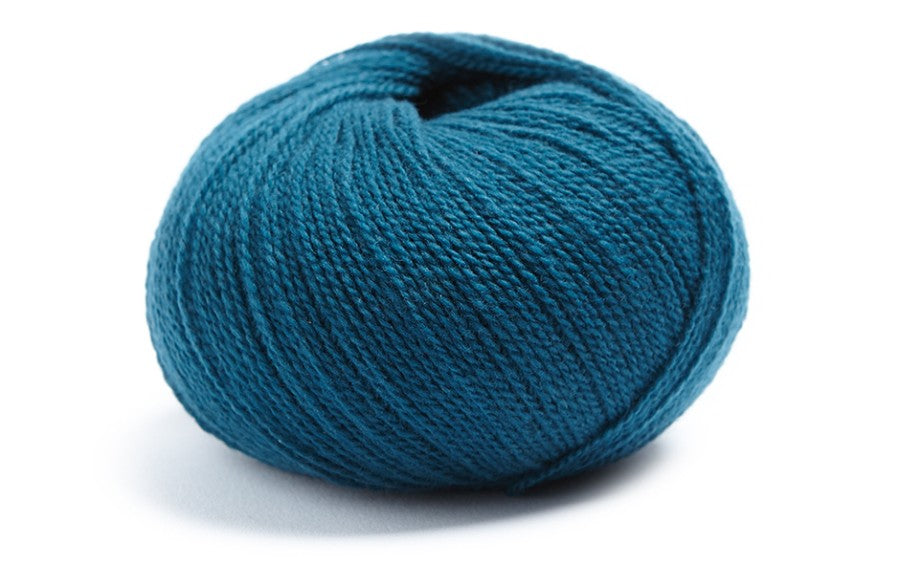 Deep teal ball of merino wool and cashmere yarn from Lamana