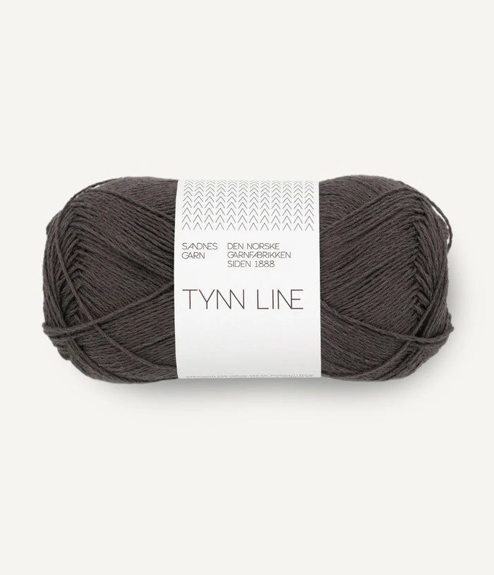 A ball of brown cotton/linen/viscose yarn labeled 'TYNN LINE' by Sandnes Garn