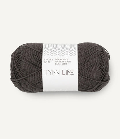 A ball of brown cotton/linen/viscose yarn labeled 'TYNN LINE' by Sandnes Garn