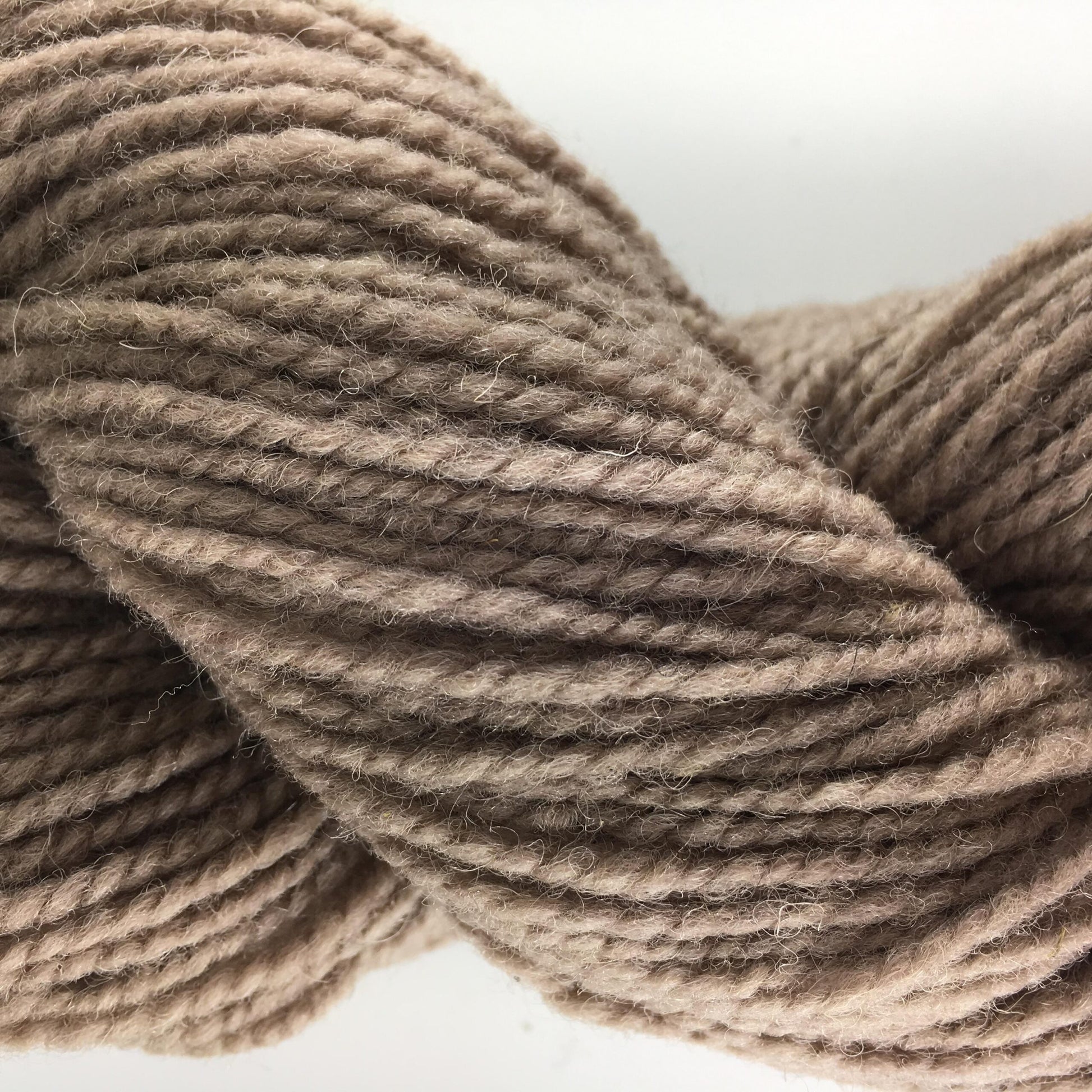 Close-up of a skein of light brown coloured wool yarn