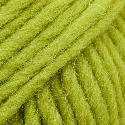 Close-up of a ball of bright green-colored wool yarn from Drops