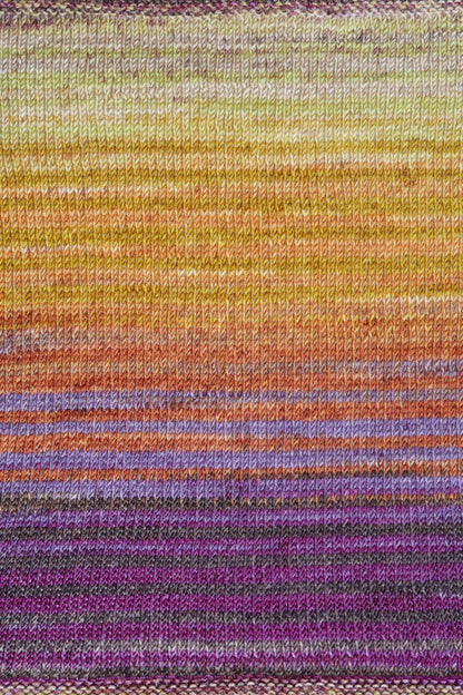 a knitted swatch of merino yarn with orange, purple, and yellow tones from Urth yarns