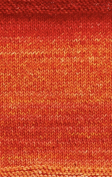 A knitted swatch of orange tonal superwash merino wool yarn from Urth