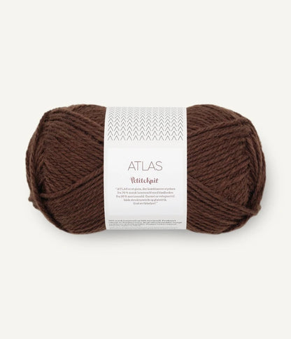 Brown yarn ball with a label on a white background