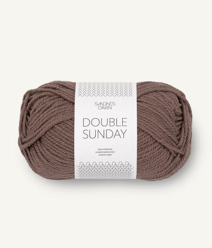 A ball of light brown coloured merino wool yarn labeled 'Double Sunday' by Sandnesgarn.