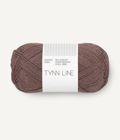 A ball of acorn brown cotton/linen/viscose yarn labeled 'TYNN LINE' by Sandnes Garn