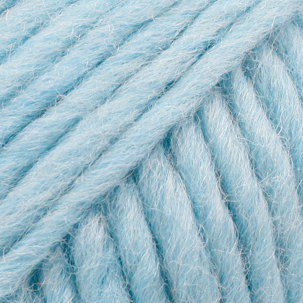 Close-up of a ball of pastel blue-colored wool yarn from Drops