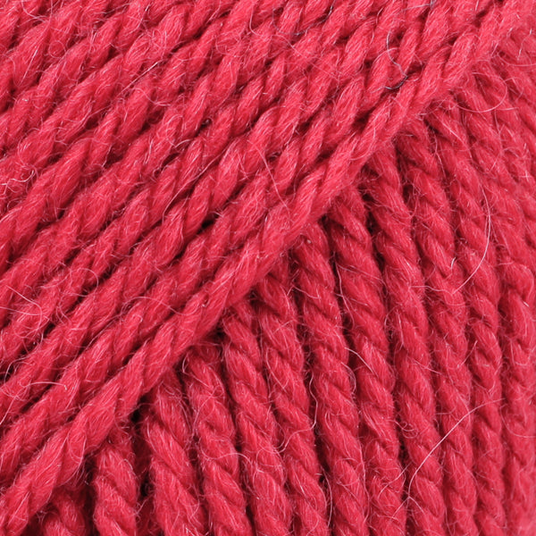 Close-up of pink-red wool and alpaca yarn from Drops