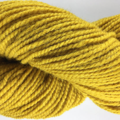Close-up of a skein of yellow coloured wool yarn
