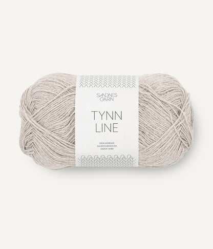 A ball of white-grey cotton/linen/viscose yarn labeled 'TYNN LINE' by Sandnes Garn