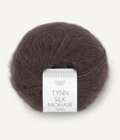 A ball of Tynn Silk Mohair yarn in a medium brown color with a 'Tynn Silk Mohair' label from Sandnes Garn