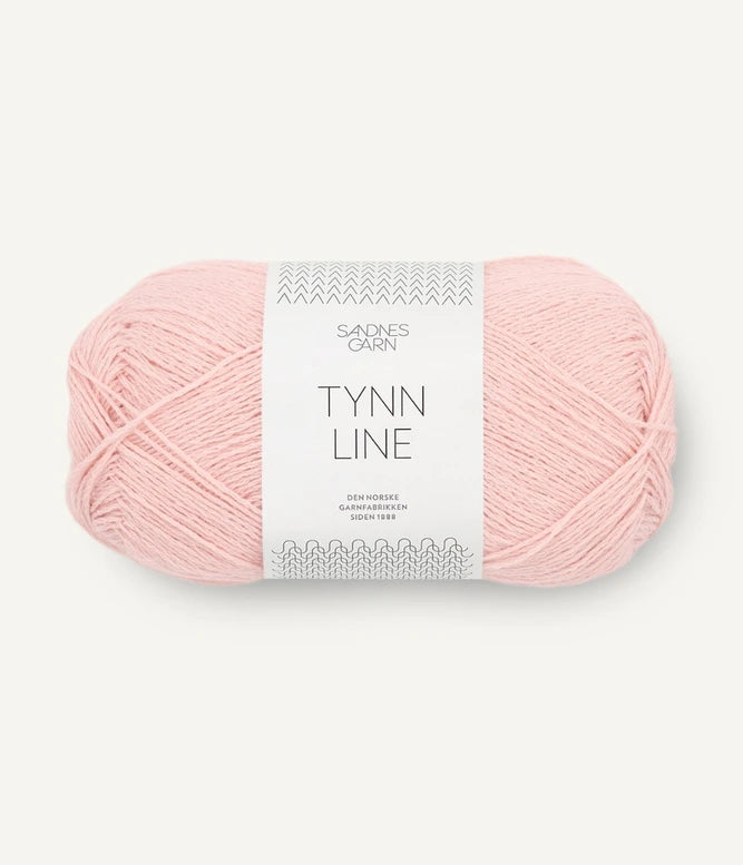 A ball of peach cotton/linen/viscose yarn labeled 'TYNN LINE' by Sandnes Garn