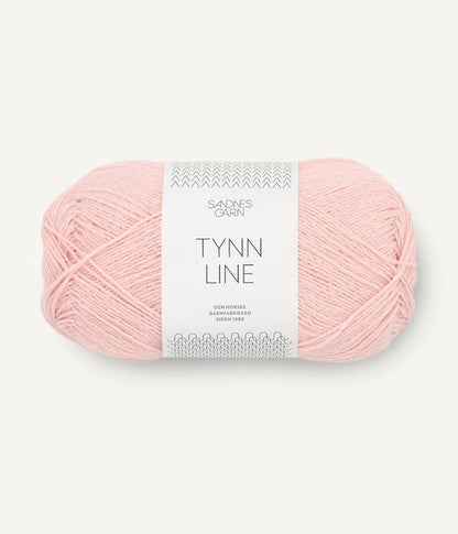 A ball of peach cotton/linen/viscose yarn labeled 'TYNN LINE' by Sandnes Garn