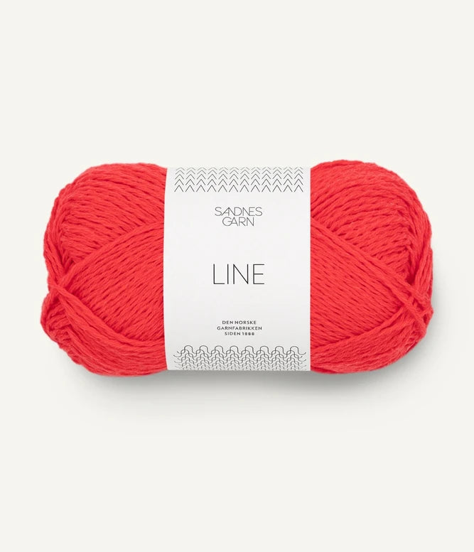 A ball of poppy red coloured cotton/linen/viscose yarn labeled 'Line' by Sandnesgarn