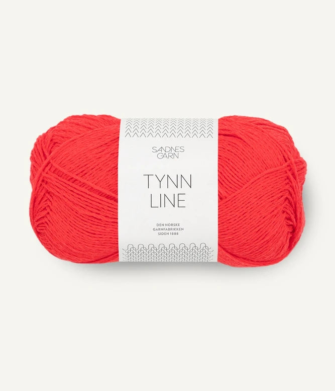 A ball of bright poppy cotton/linen/viscose yarn labeled 'TYNN LINE' by Sandnes Garn