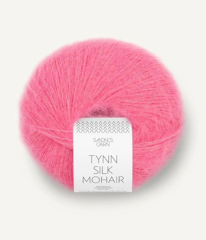 A ball of Tynn Silk Mohair yarn in a bubblegum pink color with a 'Tynn Silk Mohair' label from Sandnes Garn