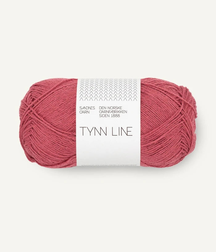 A ball of light raspberry cotton/linen/viscose yarn labeled 'TYNN LINE' by Sandnes Garn