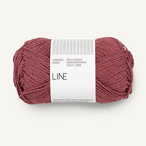 A ball of burnt rose coloured cotton/linen/viscose yarn labeled 'Line' by Sandnesgarn