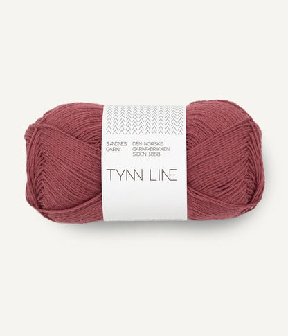 A ball of dusty rose cotton/linen/viscose yarn labeled 'TYNN LINE' by Sandnes Garn