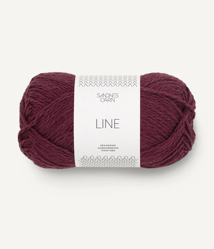 A ball of burgundy coloured cotton/linen/viscose yarn labeled 'Line' by Sandnesgarn