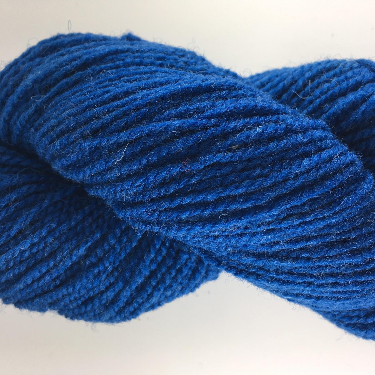 Close-up of a blue of rose coloured wool yarn