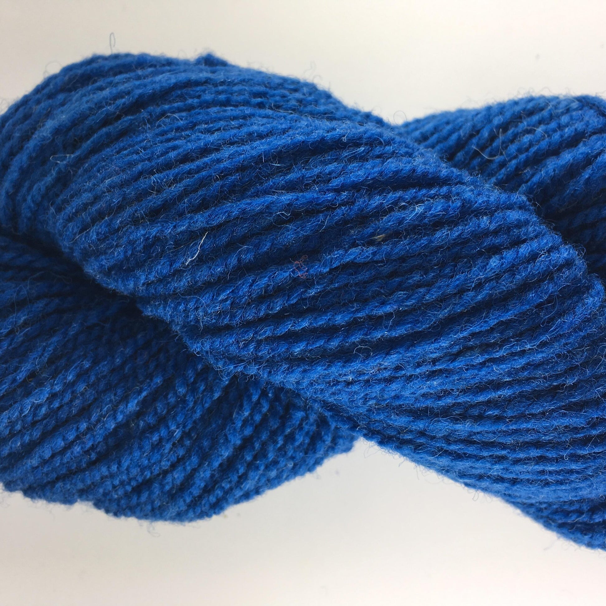 Close-up of a blue of rose coloured wool yarn