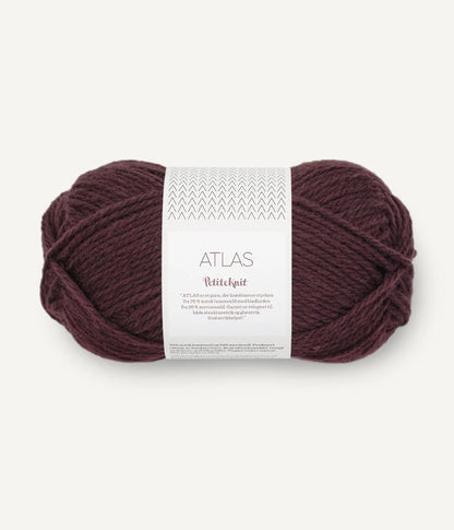 Ball of Deep Wine coloured yarn with a label on a white background