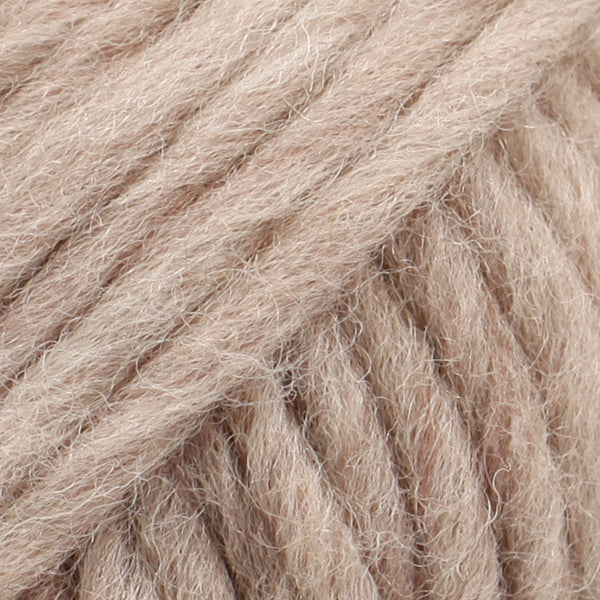 Close-up of a ball of light beige-colored wool yarn from Drops