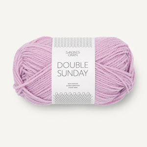 A ball of pink lilac coloured merino wool yarn labeled 'Double Sunday' by Sandnesgarn.