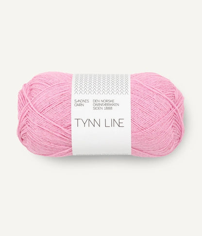A ball of bright pink cotton/linen/viscose yarn labeled 'TYNN LINE' by Sandnes Garn
