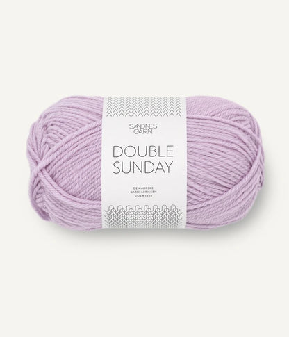 A ball of lilac coloured merino wool yarn labeled 'Double Sunday' by Sandnesgarn.