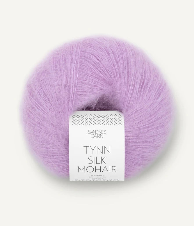 A ball of Tynn Silk Mohair yarn in a pink lilac color with a 'Tynn Silk Mohair' label from Sandnes Garn