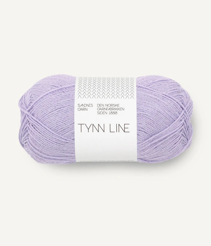 A ball of lavender cotton/linen/viscose yarn labeled 'TYNN LINE' by Sandnes Garn