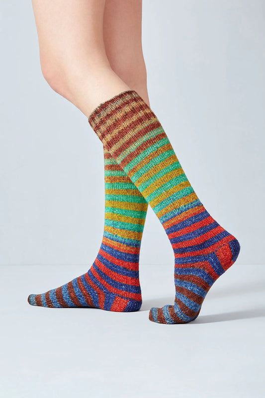 Merino and nylon knit red, blue, rust, and yellow stripe socks from Urth