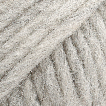 Close-up of a ball of light grey-colored wool yarn from Drops