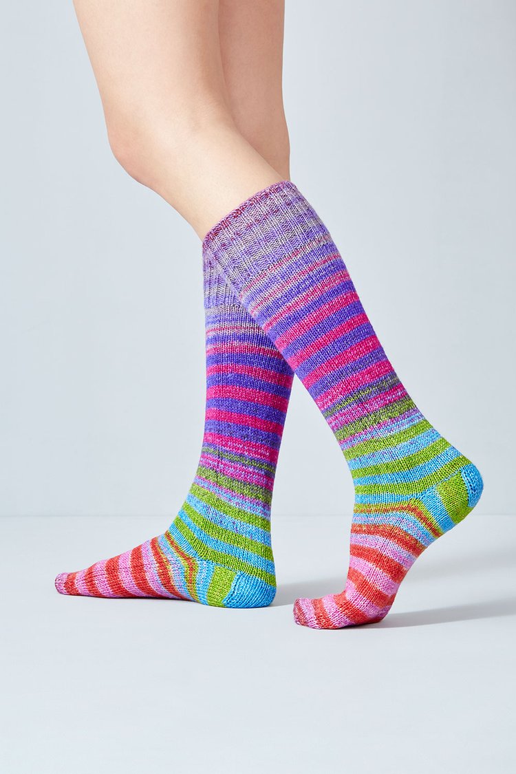 Merino and nylon knit purple, pink, green, and blue stripe socks from Urth