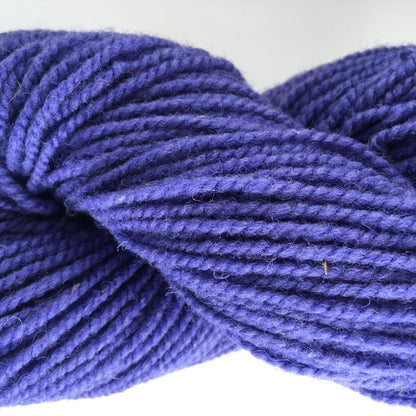 Close-up of a skein of purple coloured wool yarn